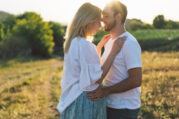 Happy and young pregnant couple in outdoors