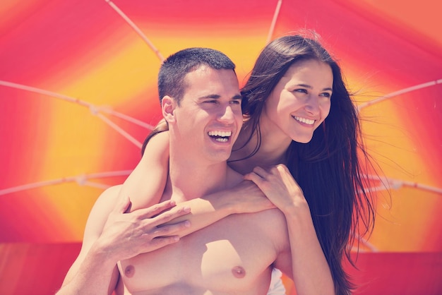 happy young romantic couple in love have fun running and relaxing on beautiful beach