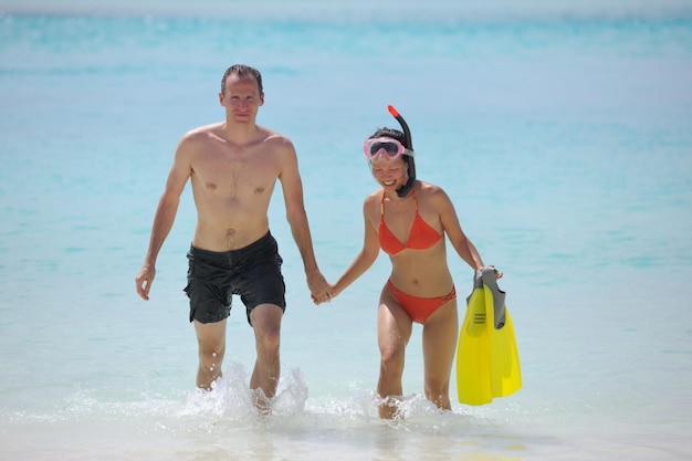 happy young romantic couple in love have fun running and relaxing on beautiful beach