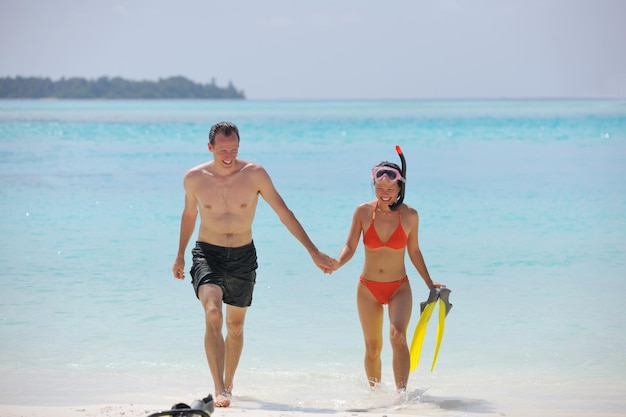 happy young romantic couple in love have fun running and relaxing on beautiful beach