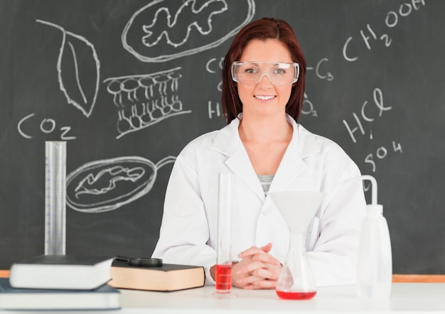 Happy young scientist looking at the camera