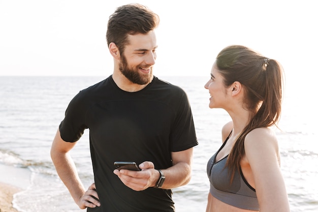 Happy young sport couple talking