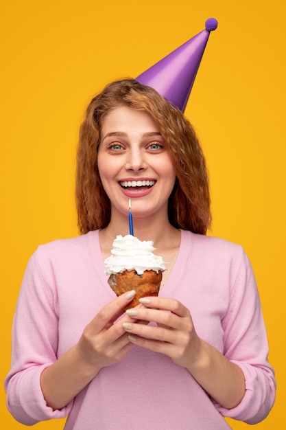 Happy young woman celebrating birthday