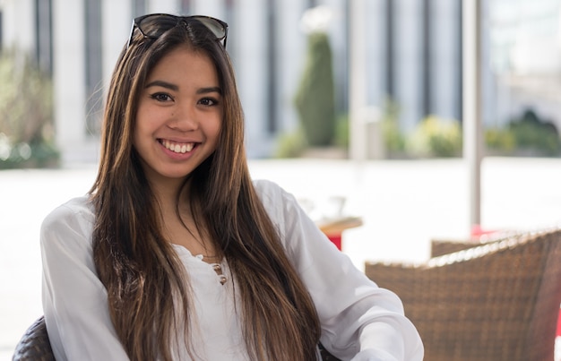 Happy young woman close up portrait smiling