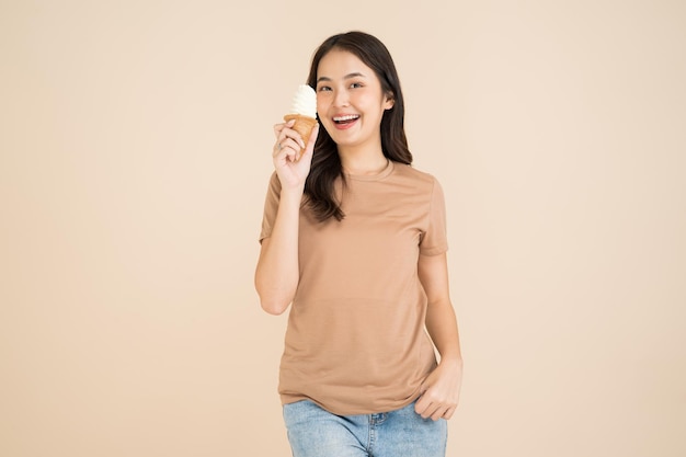 Happy young woman eating ice cream