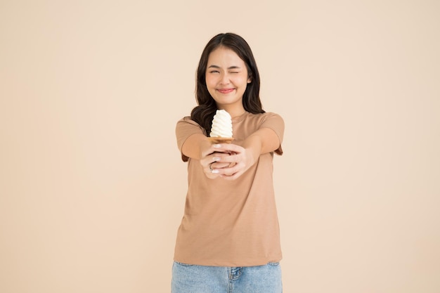 Happy young woman eating ice cream
