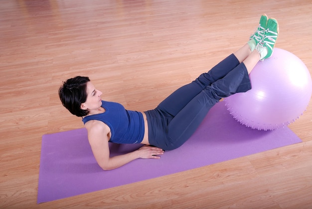 .happy young woman exercising in a gym