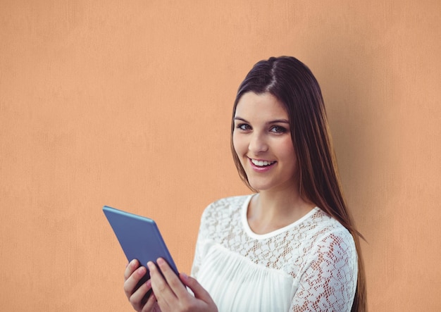 Happy young woman holding digital tablet