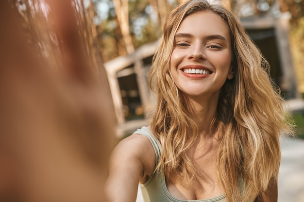 Happy young woman looking at camera