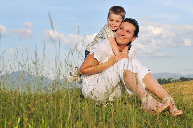 happy young woman mother play and outdoor with beautiful child