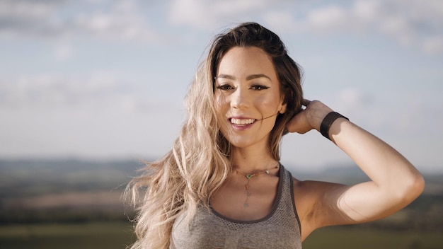 Happy young woman in nature during summer