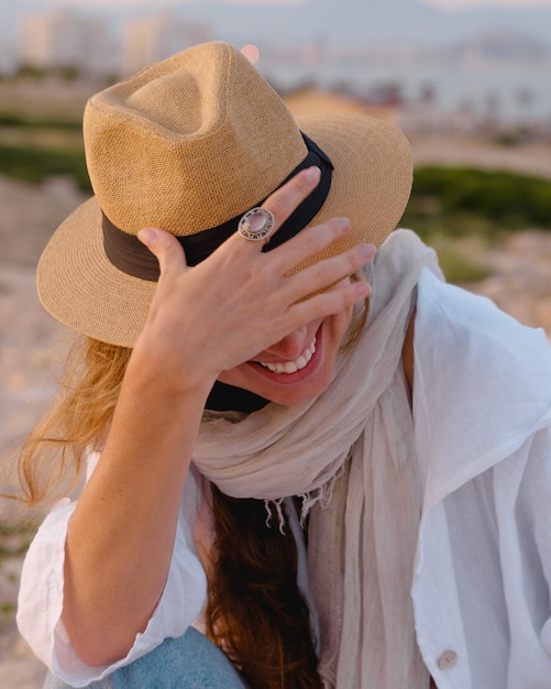 happy young woman smiles on her vacation outdoors