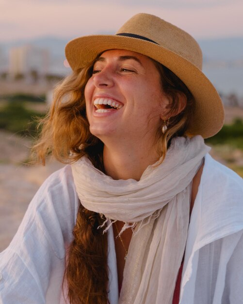 happy young woman smiles on her vacation outdoors