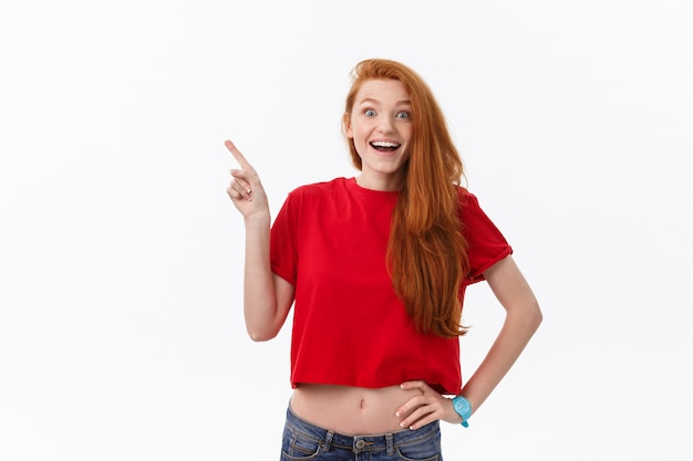 happy young woman standing isolated over white wall background.