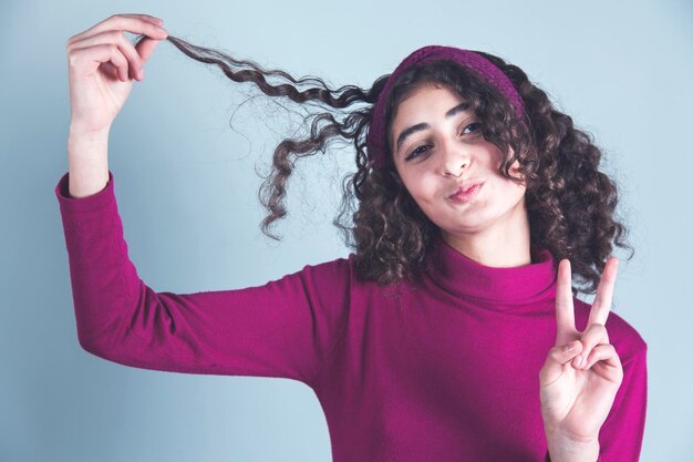 Happy young woman in studio