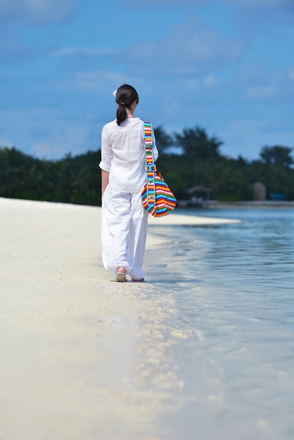 happy young woman on summer vacation on beautiful tropical beach have fun enjoy and relax