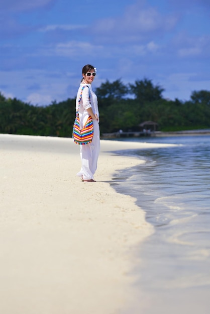 happy young woman on summer vacation on beautiful tropical beach have fun enjoy and relax