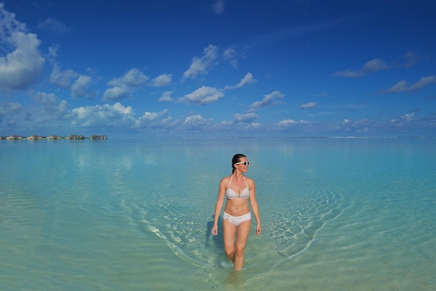 happy young woman on summer vacation on beautiful tropical beach have fun and relax