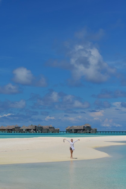 happy young woman on summer vacation on beautiful tropical beach have fun and relax