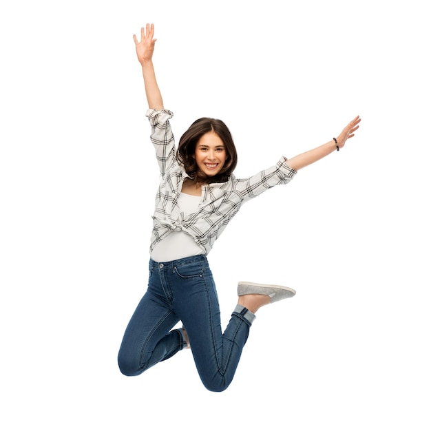 happy young woman or teenage girl jumping