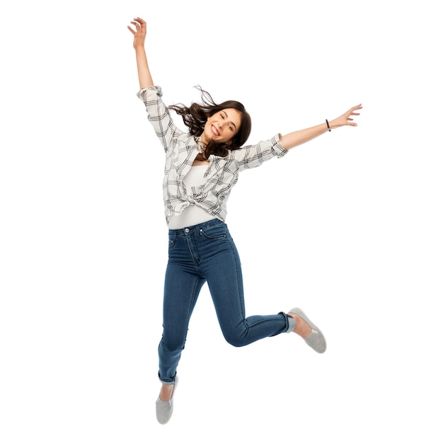 happy young woman or teenage girl jumping