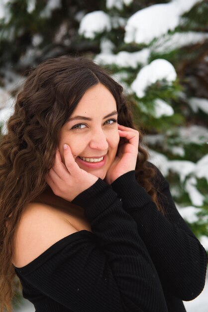 Happy young woman walking in winter time