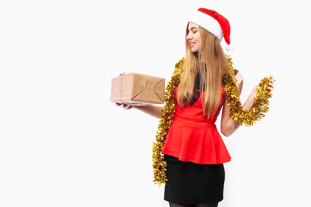 Happy young woman wearing a dress and Santa hat