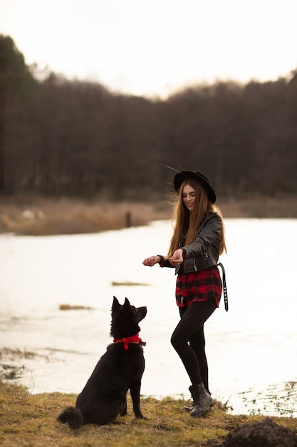 Happy young woman with black hat