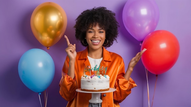 Photo happy young woman with curly hair dressed in stylish orange jacket poses with delicious birthday ca