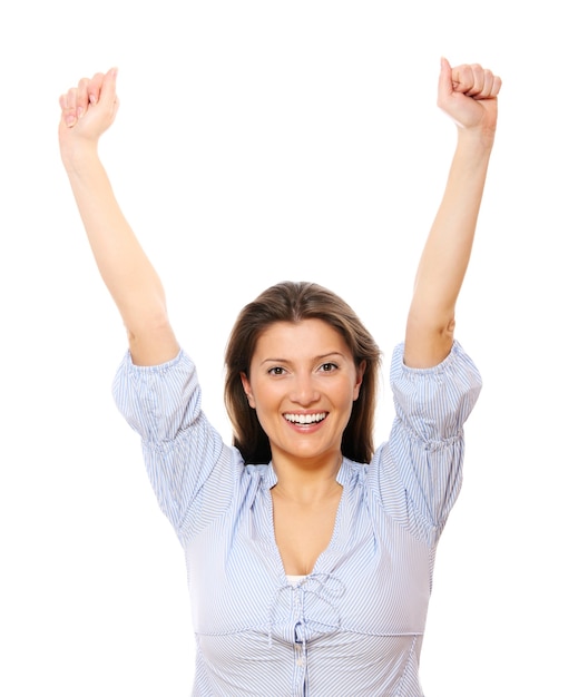 a happy young woman with her hands up over white background