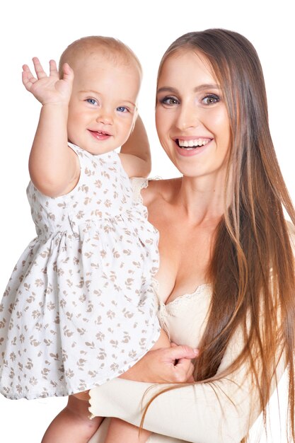 Happy young woman with little daughter on a white background