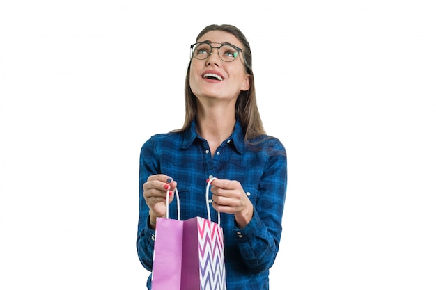 Happy young woman with a shopping bag