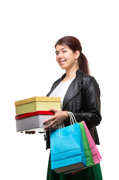 Happy young woman with shopping bags and boxes