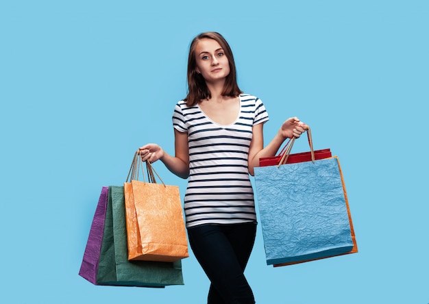 Happy young woman with shopping bags