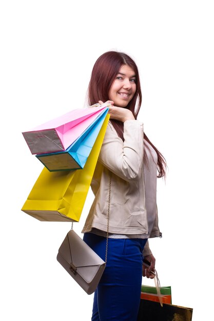 Portrait, fashion and woman with shopping bags pointing in studio isolated  on a png background. Black Friday discount, face and happy female customer  with gifts after buying at mall for sales deals.