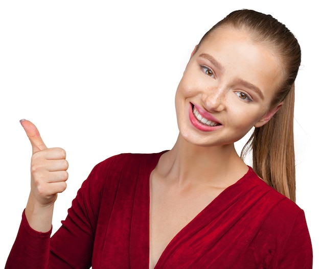 Happy young woman with thumbs up