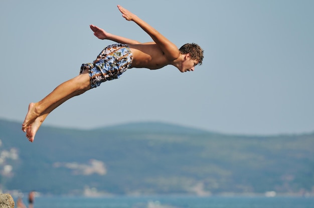 happyfriend  boys group have fun and jump in sea at summer vacation