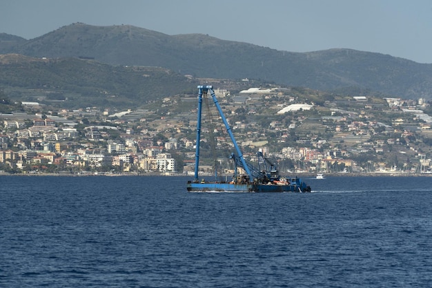 Harbor port dredge working on sea