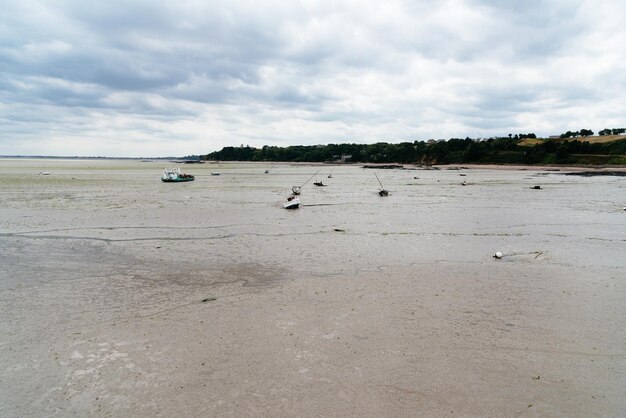 The harbour of cancale with low tide a cloudy day of summer french brittany