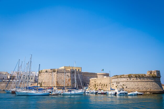 The harbour and the old walls of Gallipoli, Puglia Region - South Italy