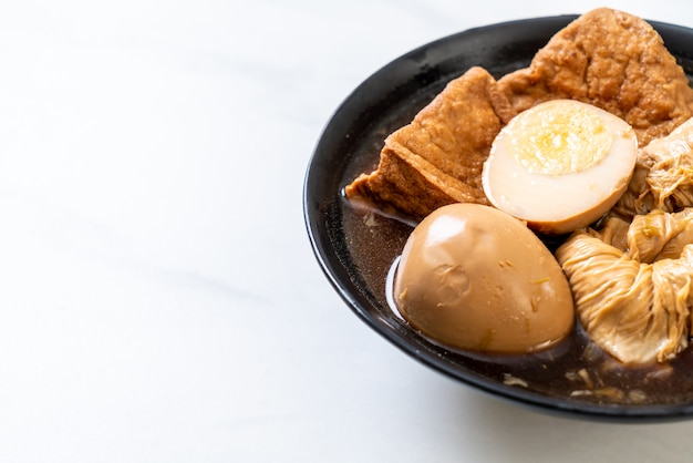 hard-boiled egg in brown sauce or sweet gravy