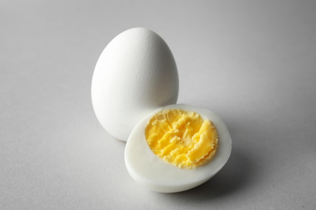 Hard boiled eggs on grey background Nutrition concept