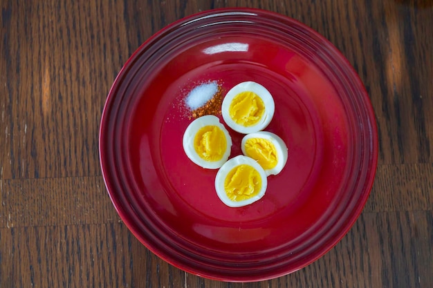 Hard boiled eggs sliced in  with pepper and salt