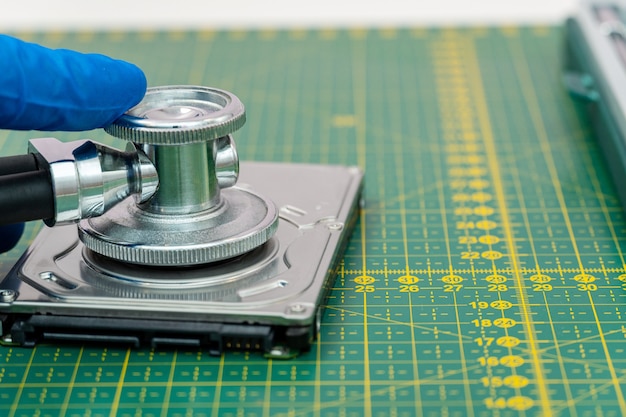 Hard drive diagnostics with a stethoscope. Recovery, search lost data, information in hdd repair service