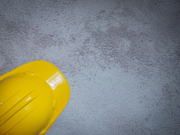 Photo the hard hats yellow cap mine safety appliances on  cement floor