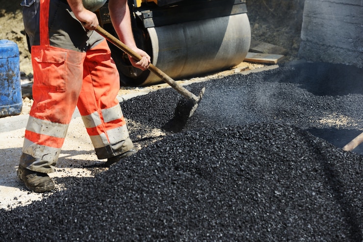 https://img.freepik.com/premium-photo/hard-work-asphalt-construction_21730-4657.jpg?w=740