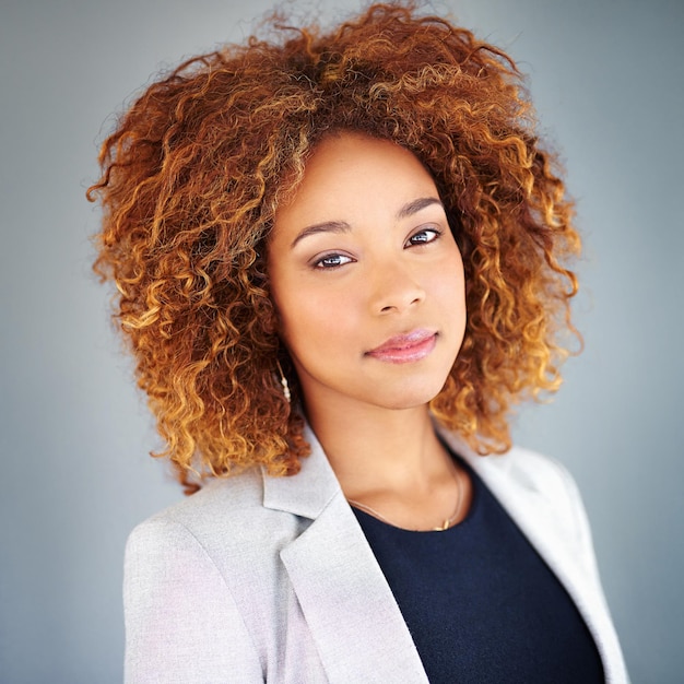 Hard work comes before success Studio portrait of a young businesswoman against a gray background