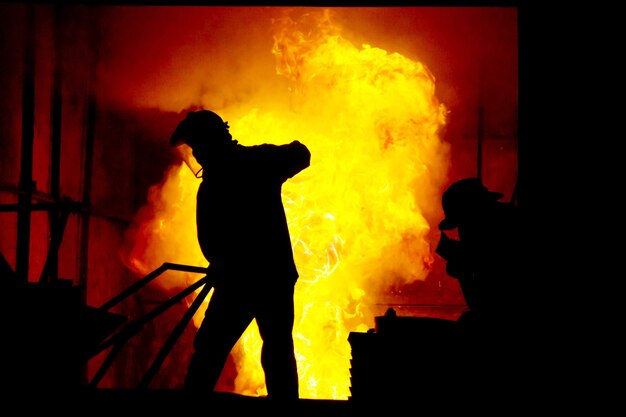 Hard work in a foundry, melting iron