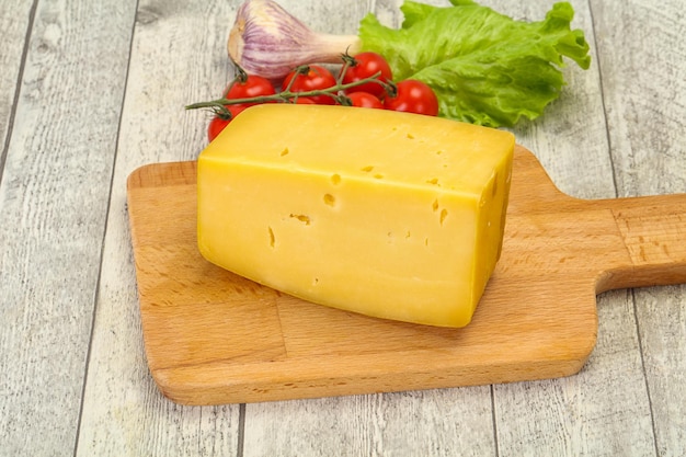 Hard yellow tasty cheese brick