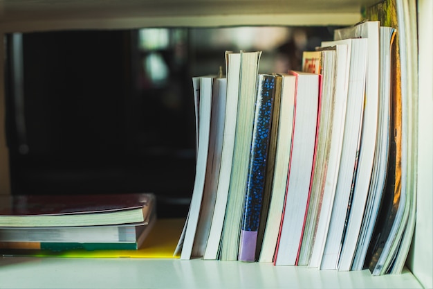 Photo hardback books on background